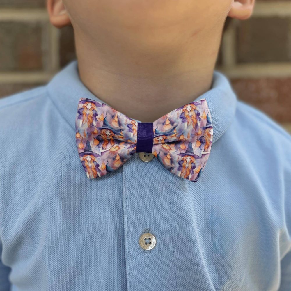 Child wearing a colorful bow tie and shirt.