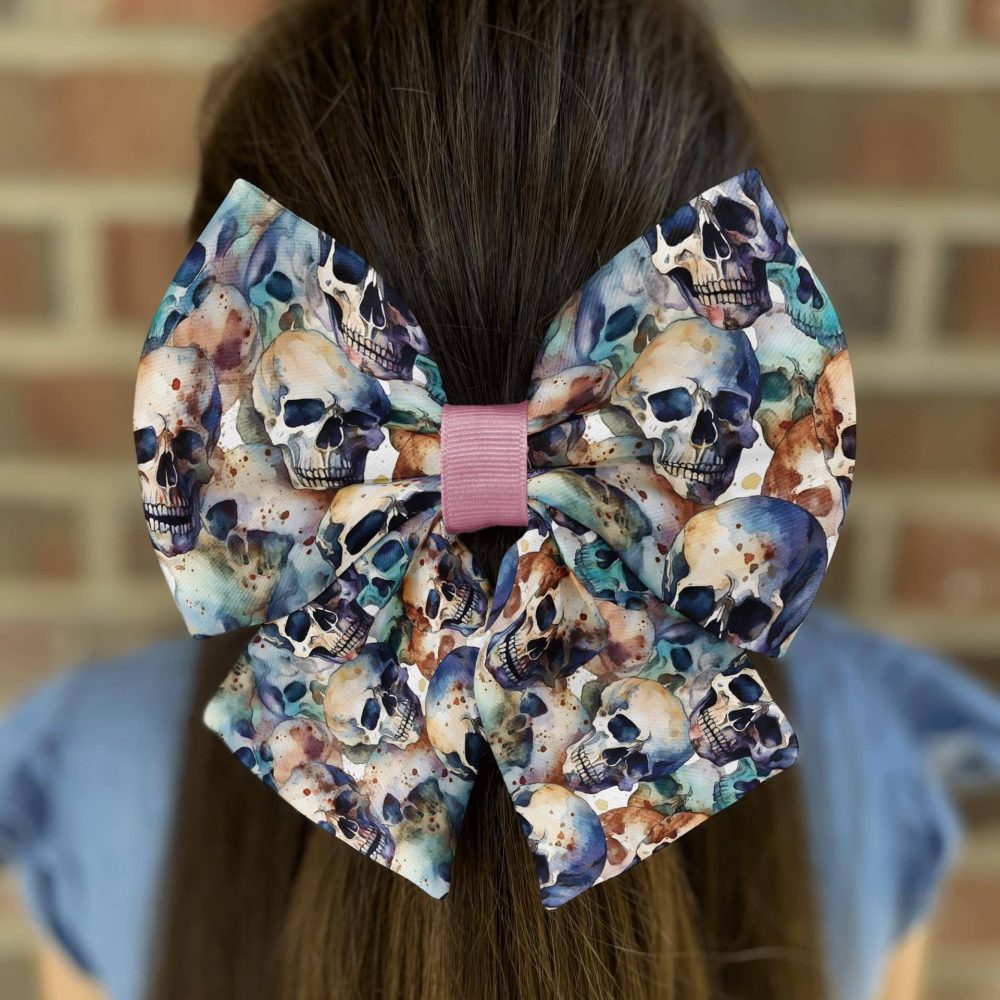 Hair bow with colorful skull design.