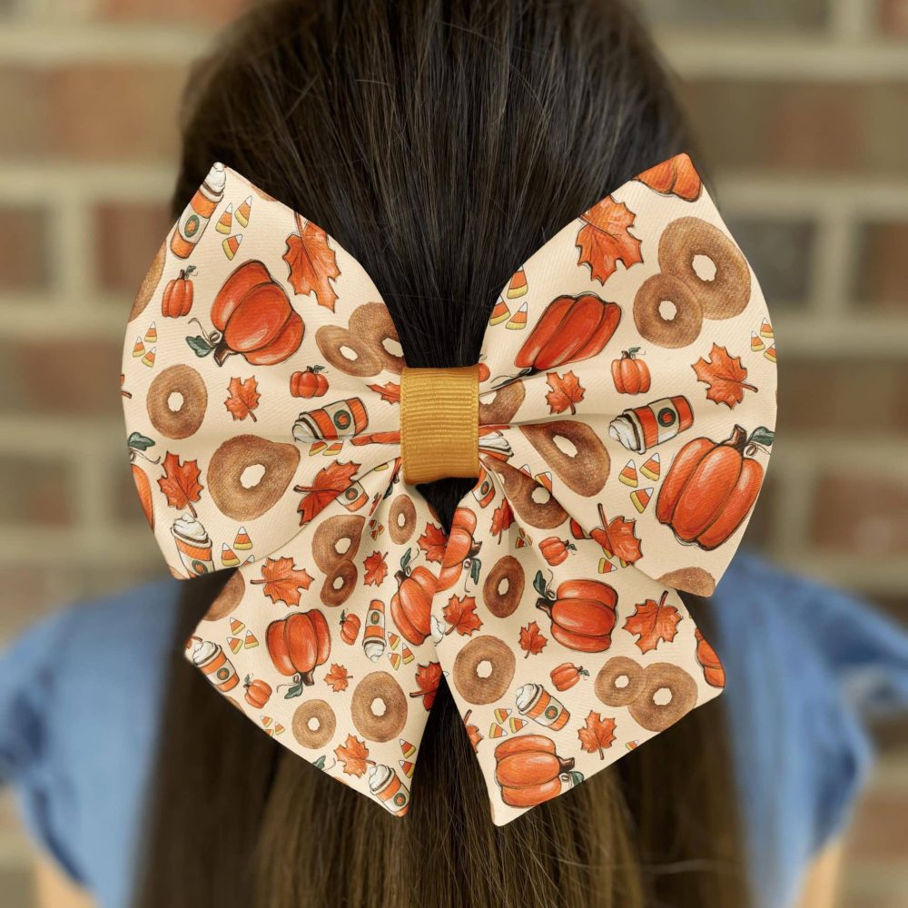 Hair bow with autumn-themed design