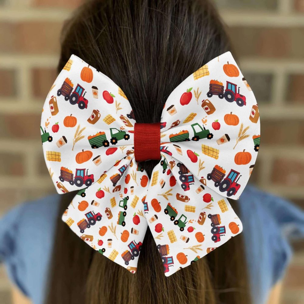 Girl wearing farm-themed hair bow.