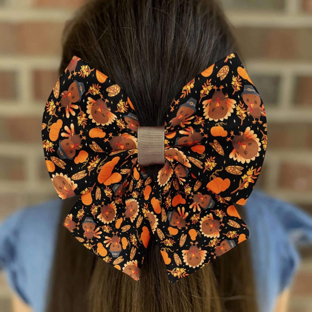 Woman with fall-themed hair bow