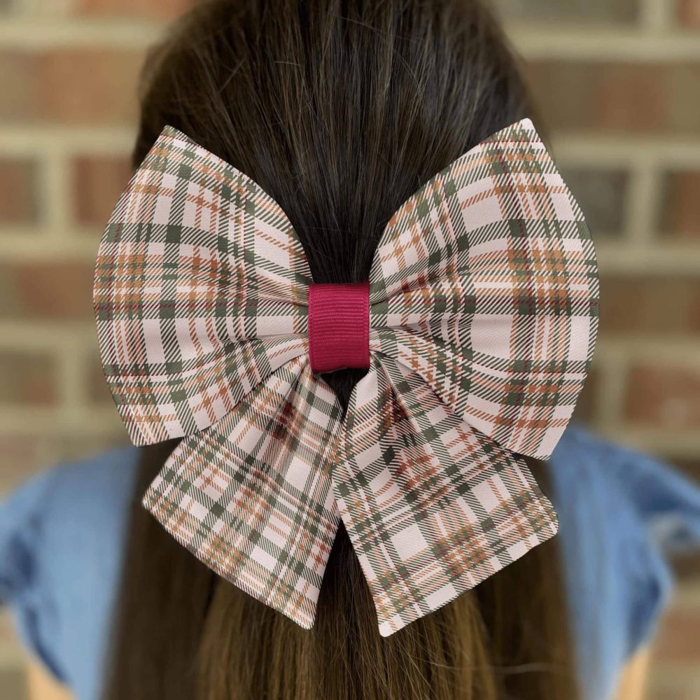 Plaid hair bow on brown hair.