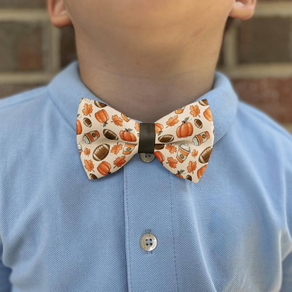 Child wearing fall-themed bow tie and blue shirt