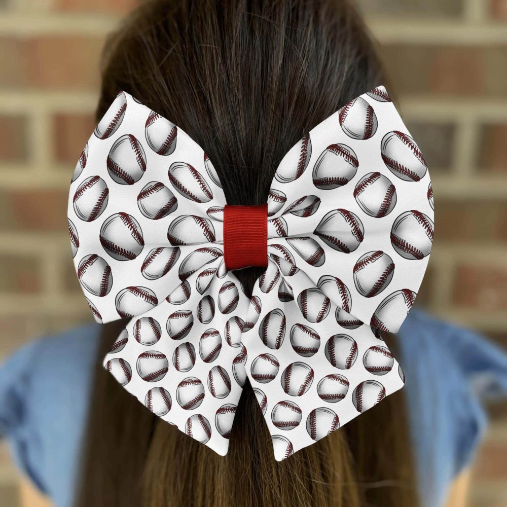 Baseball-themed bow on girl's hair