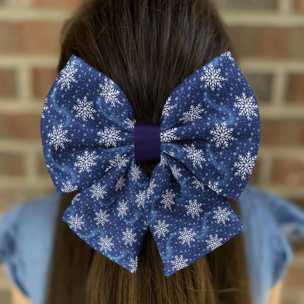 Blue snowflake bow on brown hair