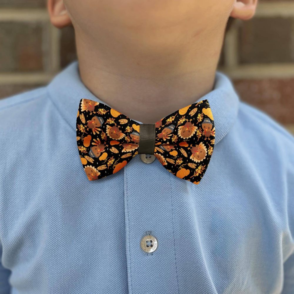 Child wearing autumn-themed bow tie