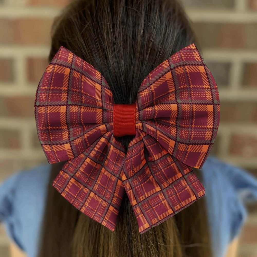 Girl with large plaid hair bow.