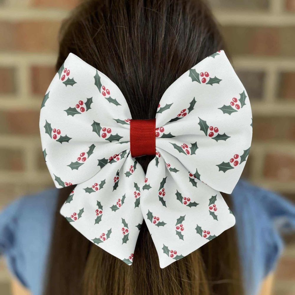 Christmas bow with holly design in hair