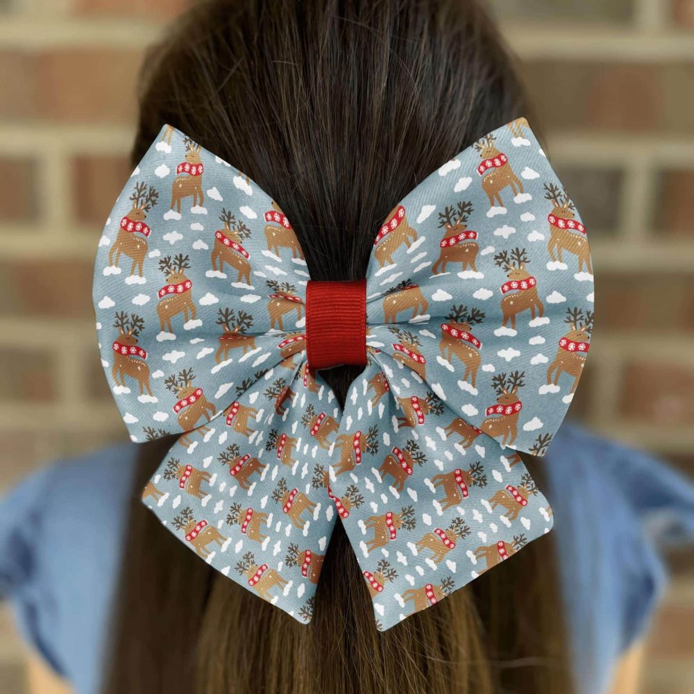 Hair with large Christmas bow accessory.